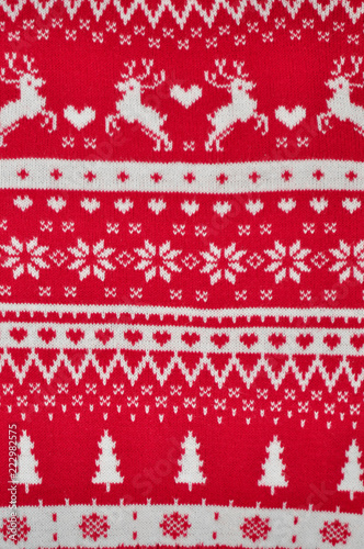 Element decor Christmas red knitted sweater close-up. Holiday gift. Backgdound