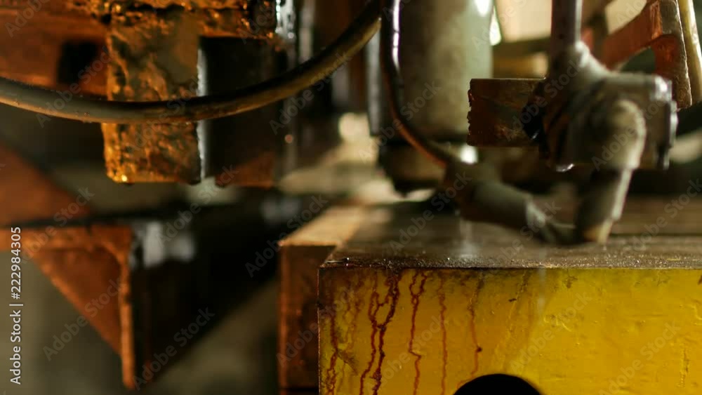 the worker is engaged in cutting of metal on the production automatic machine tool, metal cutting,close-up