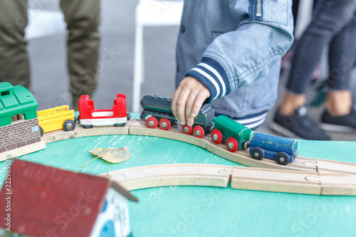 kids playing with toy railway road