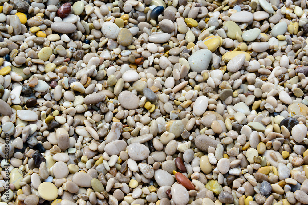 Background image of pebbles on a beach Background image of pebbles on a beach