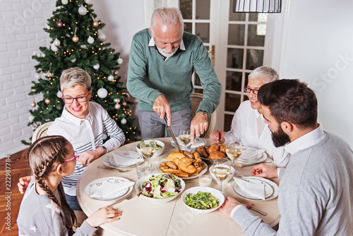 Family gathered over Christmas holidays  celebrating  having lunch 