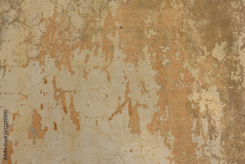 texture of old peeling yellow plaster