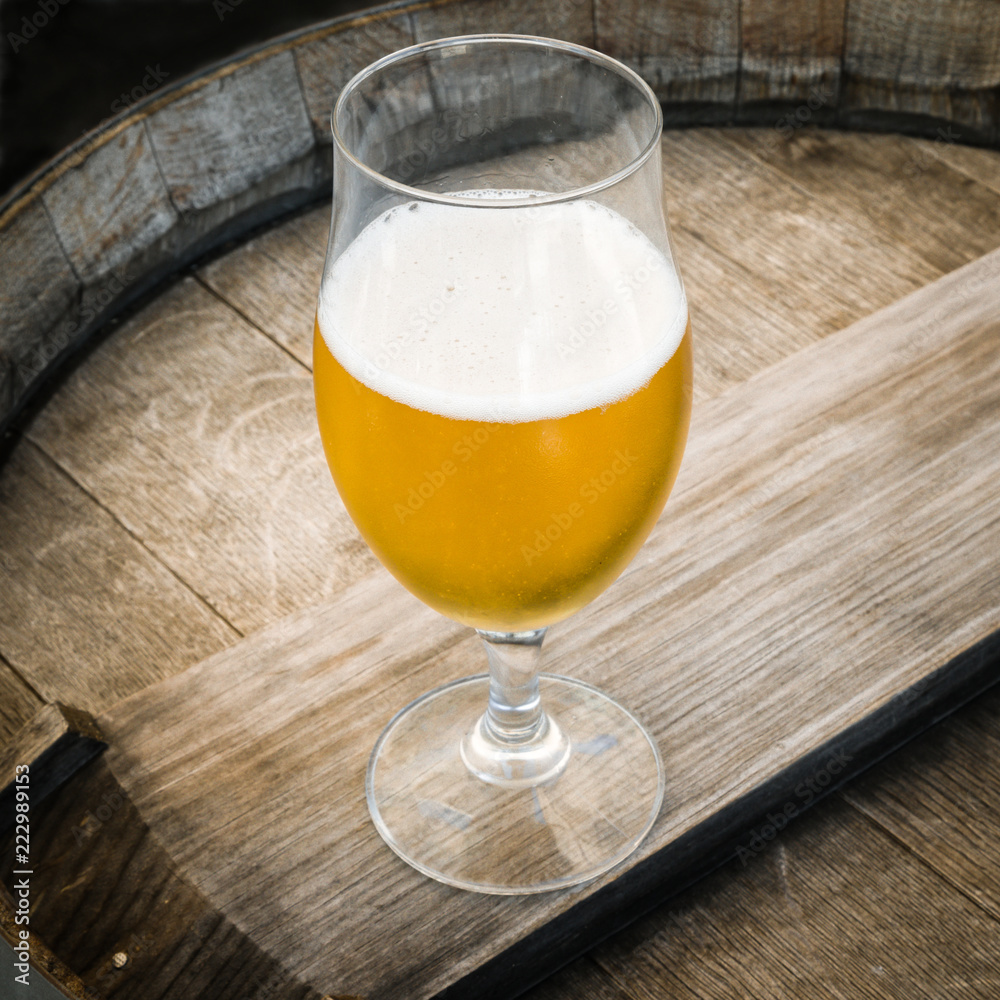 glass of beer on wooden background glass of beer on wooden background