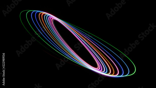 Colourful abstract with swooshes, swirls, spirals and elipses on a black background. photo