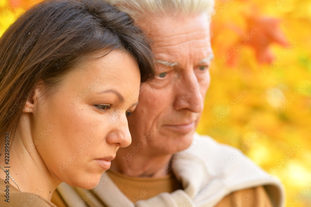 Portrait of Sad woman and senior man hugging Portrait of Sad woman and senior man hugging