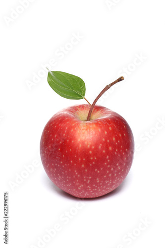 red apple with a leaf isolated on white background