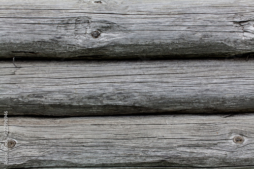 Wooden texture of round logs gray grunge texture