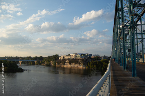 Man walking on bridge toward landmark in Chattanooga, Tennessee, © Chadd