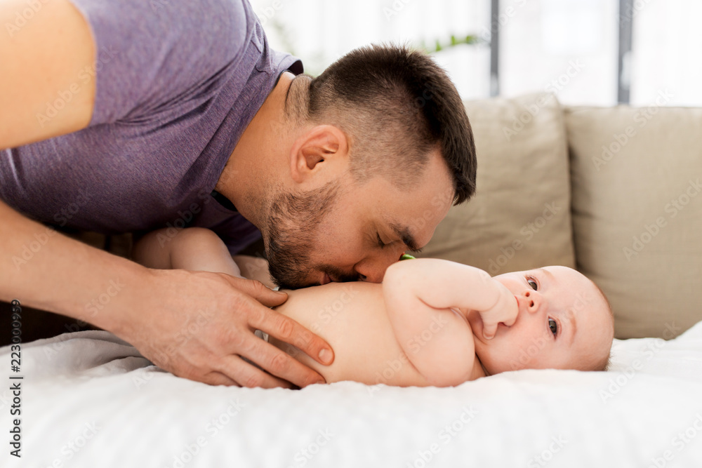 family, fatherhood and people concept - close up of father with little baby at home family, fatherhood and people concept - close up of father with little baby at home