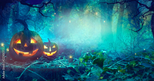 Halloween theme with pumpkins and dark forest. Halloween design