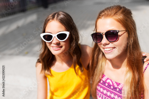 summer fashion, eyewear and people concept - smiling teenage girls in sunglasses outdoors © Syda Productions