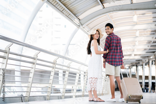 Man and women Asian couples Traveling during the summer season. The wedding anniversary. By booking through an agency. It is fun to relax during the weekend. The schedule is well planned.