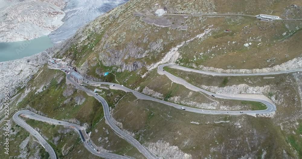 Curvy Furka mountain pass with Rhone glacier from a bird's eye view in the canton of Valais, Switzerland Curvy Furka mountain pass with Rhone glacier from a bird's eye view in the canton of Valais, Switzerland