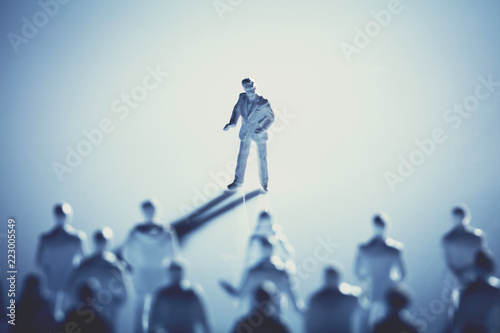 Man standing in front of people on white background