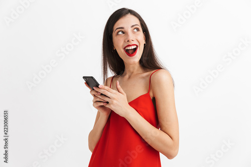 Portrait of an excited young woman in dress