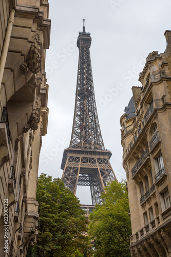 View of Eiffel Tower through the ancient buildings in Paris  France