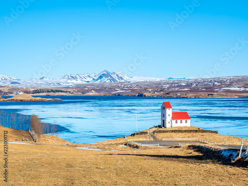 Ulfljotfvatnskirkja, church on lake, Iceland photo