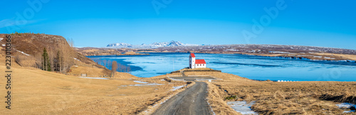 Panoramic view of Ulfljotfvatnskirkja, church on lake, Iceland photo