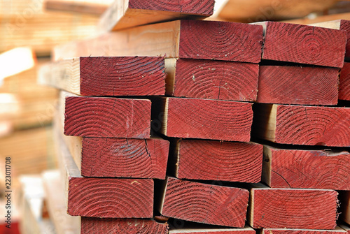 Wood studs stacked on  a construction site. photo