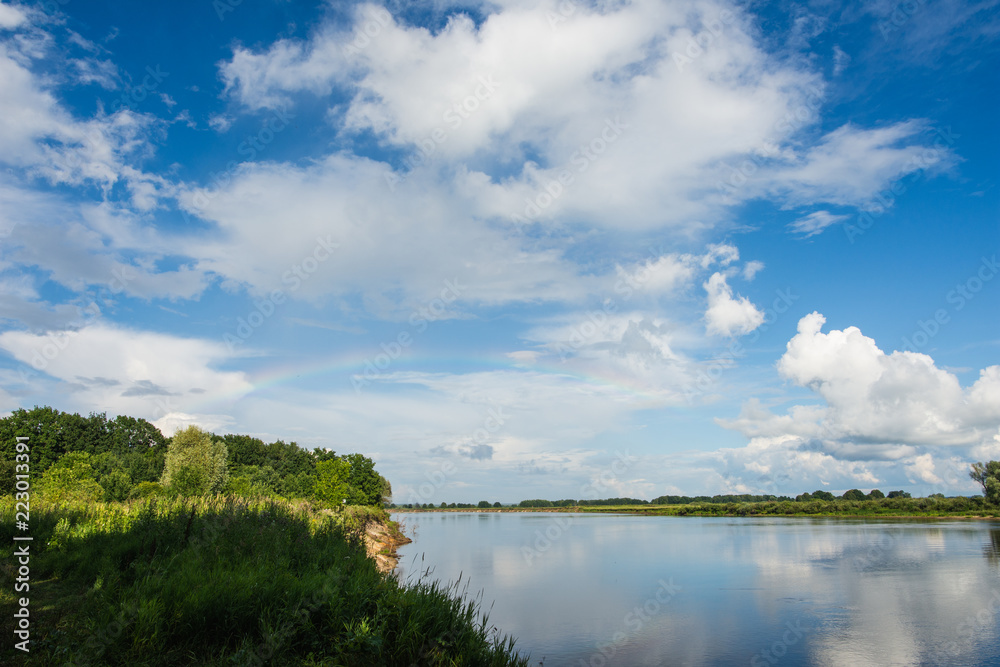 Oka river in summer Sunny day with rainbow