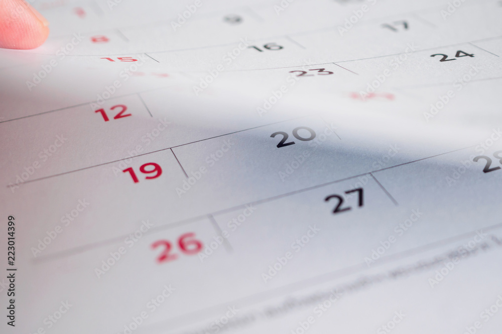 Hand hold calendar page flipping sheet close up background Hand hold calendar page flipping sheet close up background