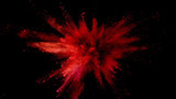 Explosion of coloured powder on black background.