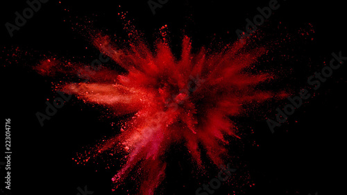 Tablou canvas Explosion of coloured powder on black background.