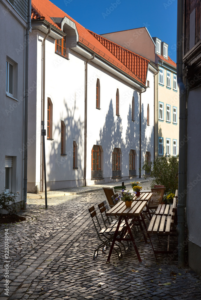 Cozy outdoor cafe on traditional pedestrian street in Erfurt