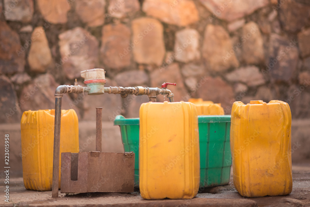 Water Collection Rwanda Stockfoto Jerrycans and buckets next to a tap to collect water in ...