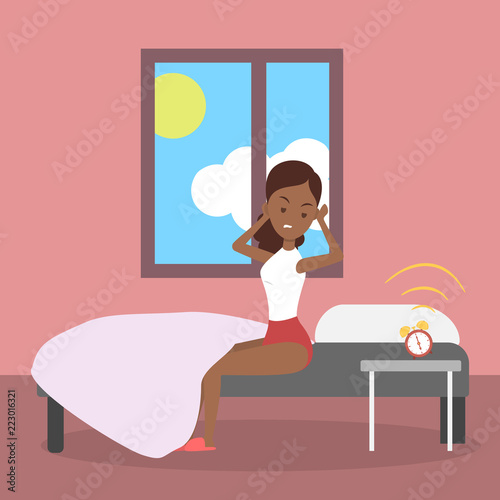 Angry woman waking up in a bad mood
