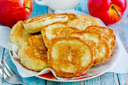 Sweet apple pancakes on plate close up