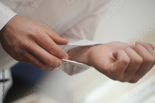 A man wraps a shirt