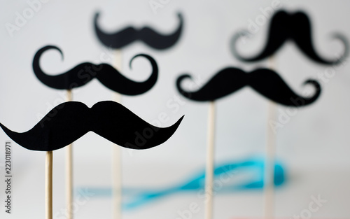 Canvas Print A lot of black paper moustaches on sticks