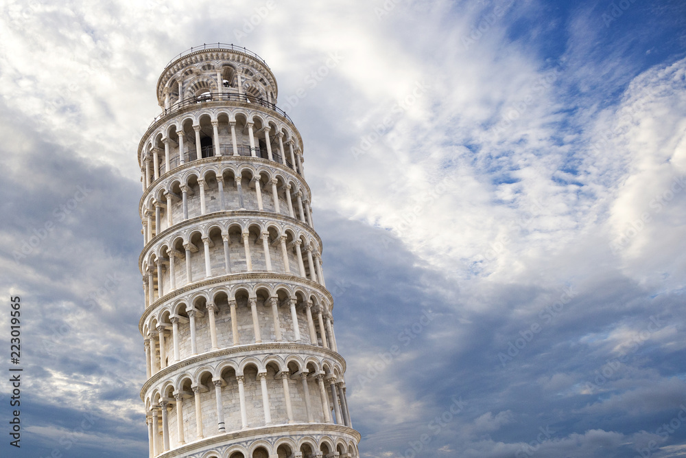 Closeup of Leaning tower of Pisa with beautiful dramatic sky on the background