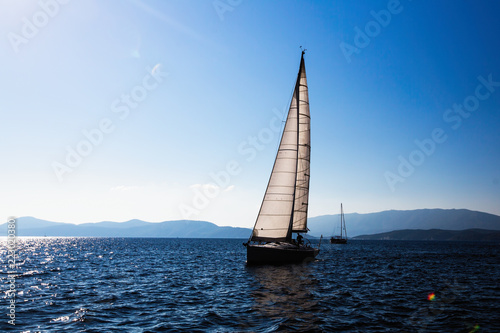 Sailing ship luxury yacht with white sails in the Sea.