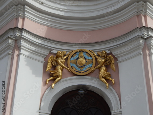 Golden angels above the entrance to the temple, a fragment of the facade