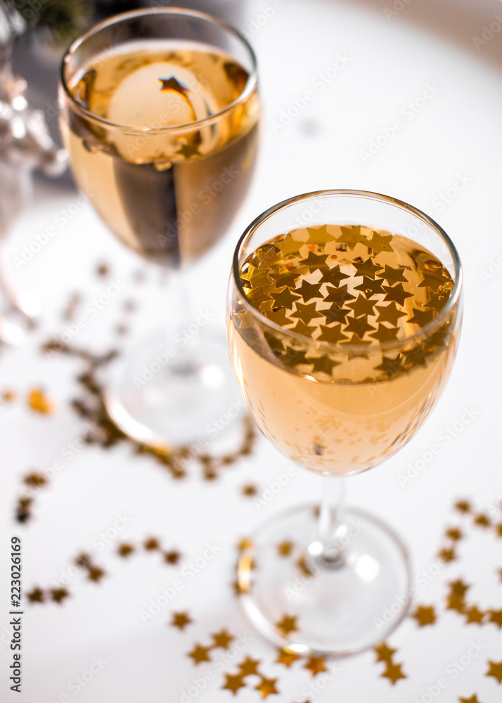 A glass of champagne with golden stars A glass of champagne with golden stars