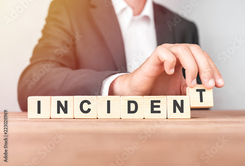 Man made word INCIDENT with wood blocks photo