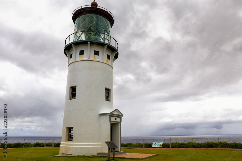 Storm clouds gather above a Hawaiian lighthouse