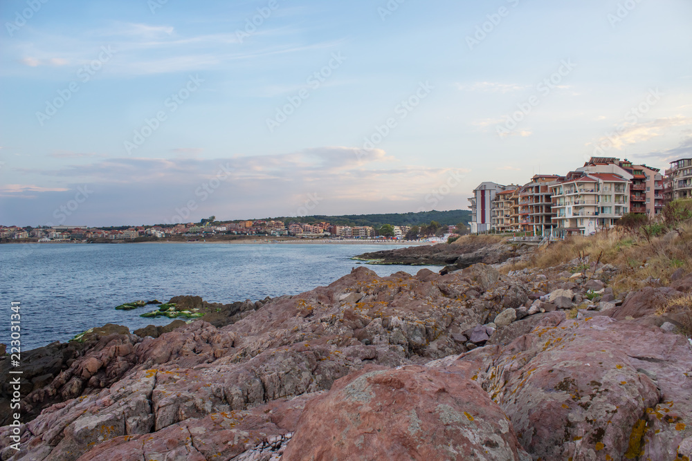 Shore with houses and rocks