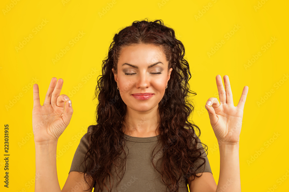 beautiful young woman meditating happily beautiful young woman meditating happily
