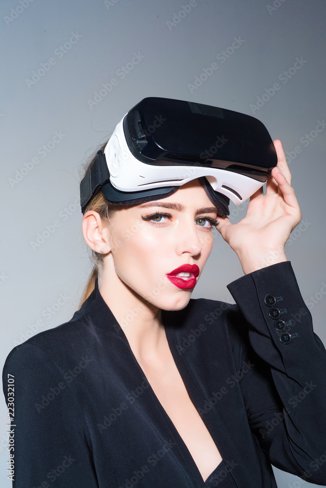 Virtual reality. Beautiful woman in virtual reality headset. Girl with makeup with virtual reality goggles at head. Future. Future technology concept. Girl using VR headset. Games. Virtual reality. Beautiful woman in virtual reality headset. Girl with makeup with virtual reality goggles at head. Future. Future technology concept. Girl using VR headset. Games.