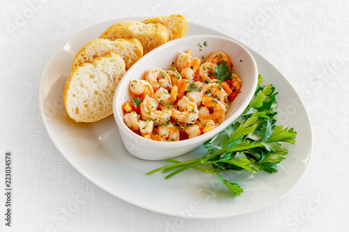 fried in garlic butter and olive oil seafood with parsley and bread