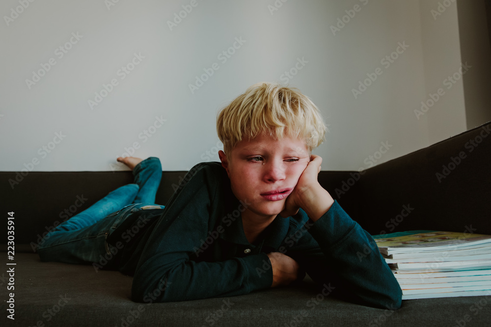 Obraz premium little boy cry tired of doing homework, overload, stress