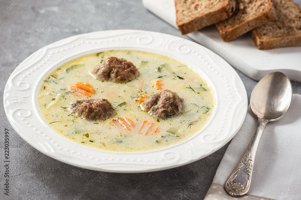 Creamy vegetable soup with beef meatballs.