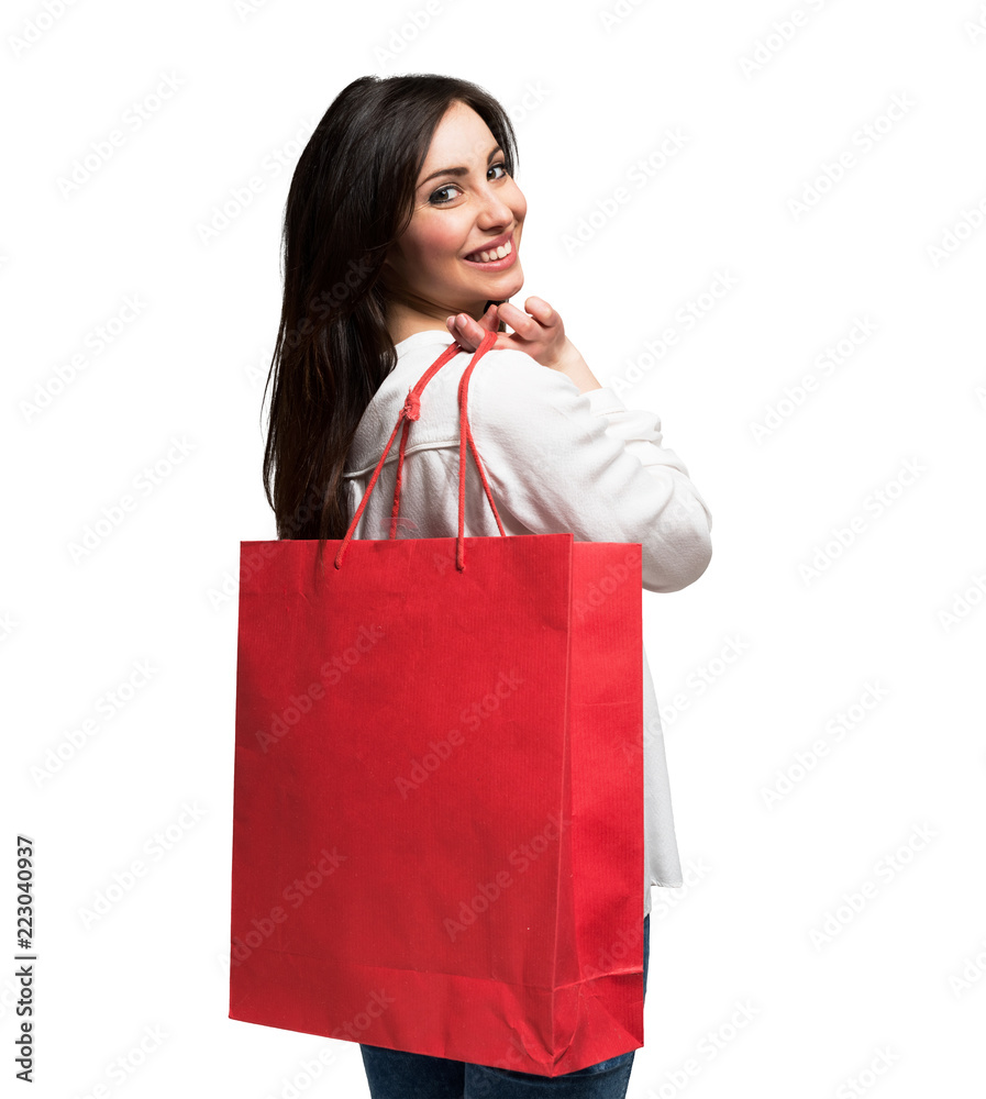 Smiling woman holding a shopping bag. Isolated on white Smiling woman holding a shopping bag. Isolated on white