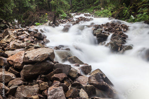 Fast and rapid mountain stream current after rain