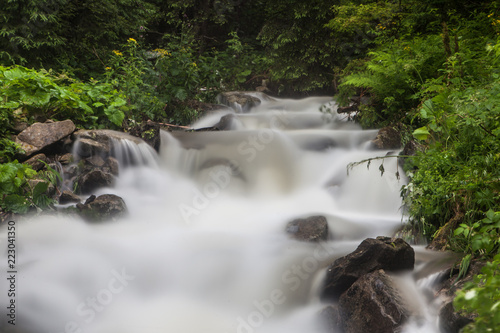 Fast and rapid mountain stream current after rain