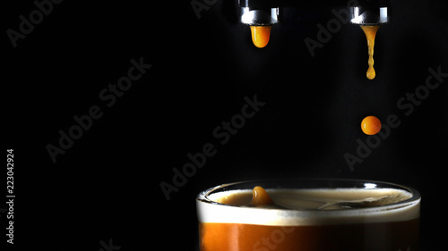 Obraz na płótnie Droplet of coffee splashing in a mug