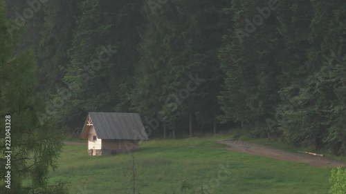 Poland,Zakopane, View of the highlander hut. In the background of mountains TATRY, Clouds. Trees and meadows. Sleeping knight and cross at Giewont. Sunrise. Panning camera, Pan, Closeup photo